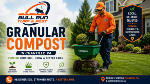 Lawn care technician spreading granular compost treatment on a residential lawn in Chantilly, Virginia.