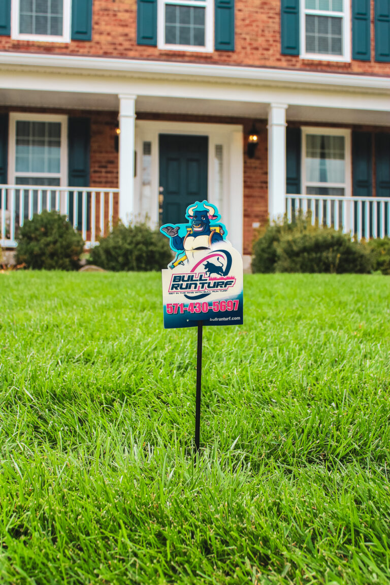 Lawn aeration and overseeding equipment in use on residential lawn in Chantilly, Virginia