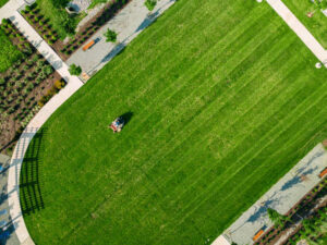 Commercial lawn care crew mowing business property landscaping in Northern Virginia
